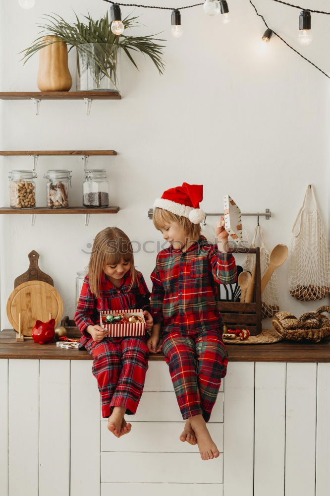 Similar – Image, Stock Photo Mother and son putting christmas costume on