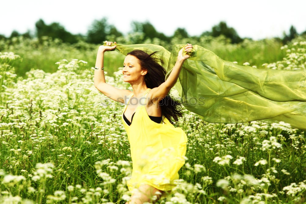 Similar – Image, Stock Photo Beautiful young woman in summer on yellow meadow from rape to horizon. Pretty girl with zest for life enjoys the sunshine break and life. Rest and recharge energy from time stress in environment and nature idyll. Laterally from behind.