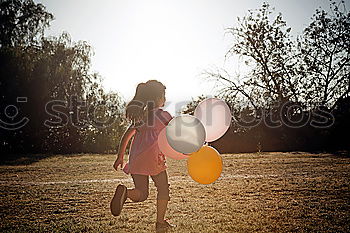 Girl with balloons