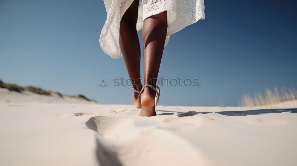 Similar – Caucasian woman sitting in wet suit on towel at the beach