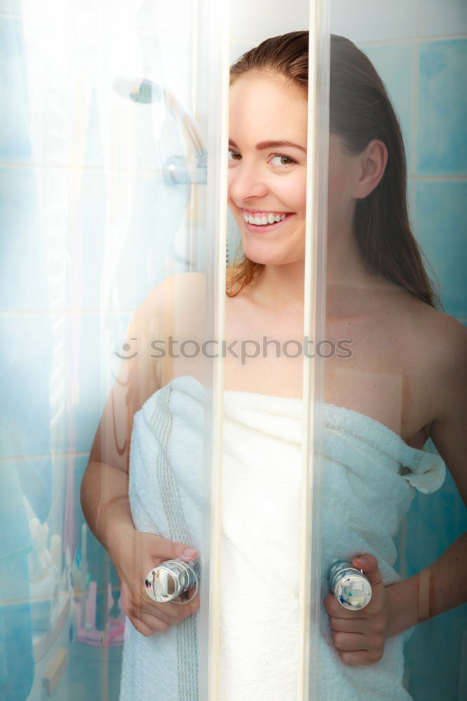 Similar – woman portrait leaning on a door side wearing swimsuit