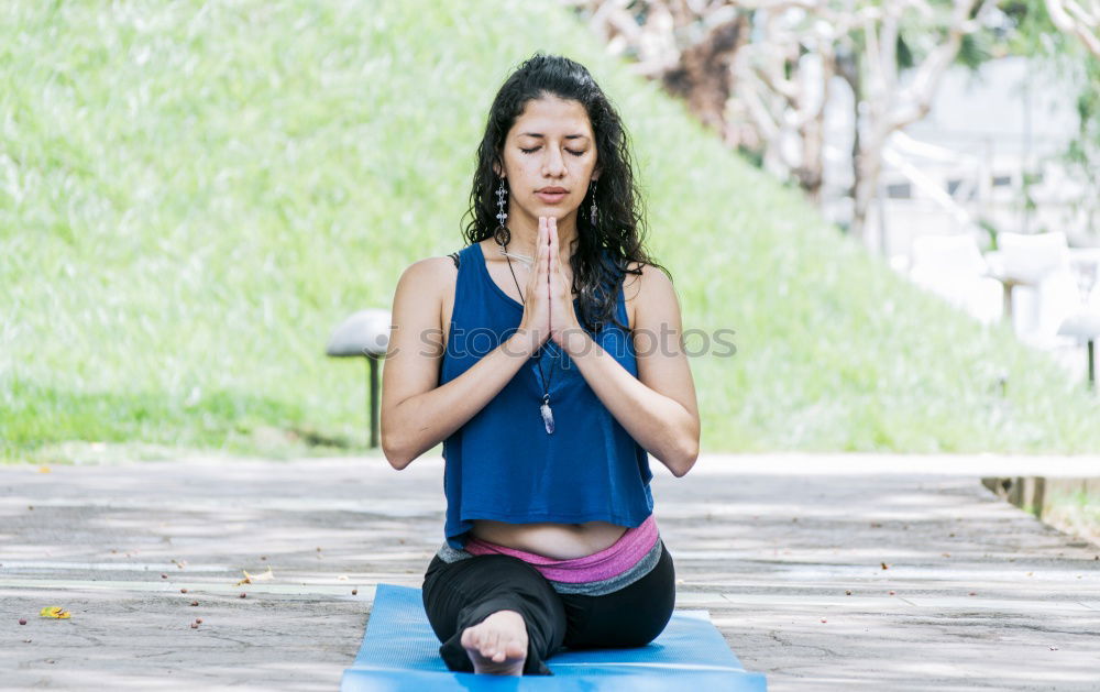 Similar – Young woman meditates in yoga asana Padmasana