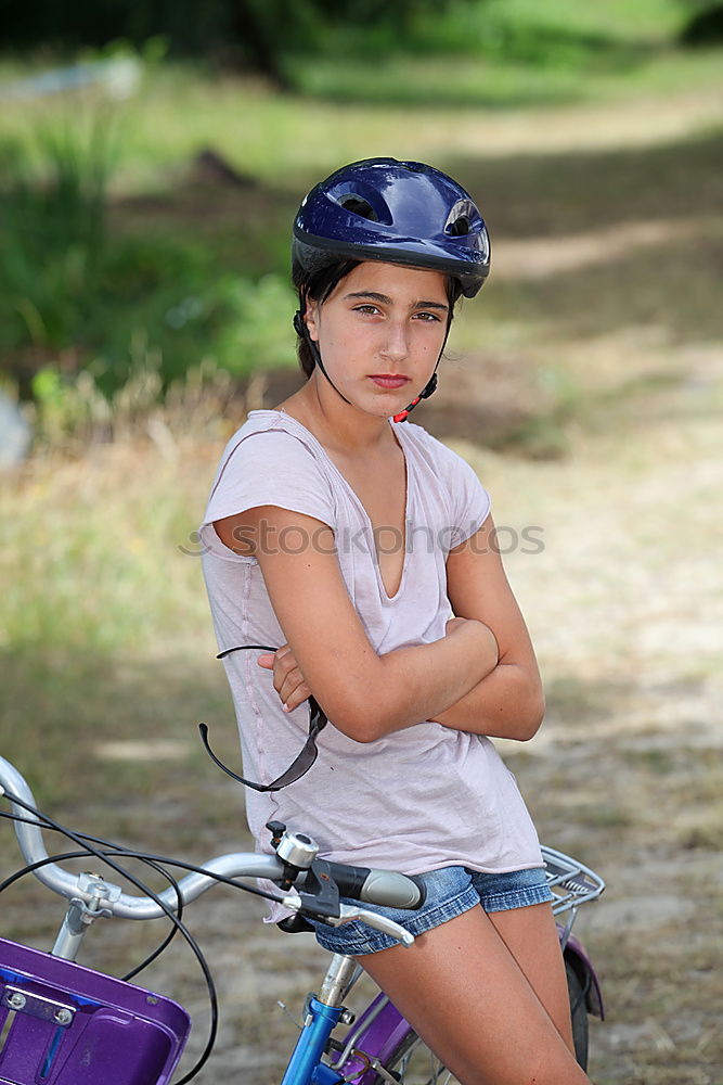 Similar – Cute girl driving bicycle in summer