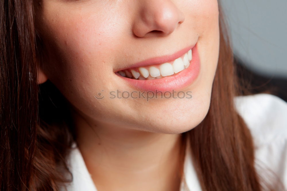 Similar – Close portrait of beautiful young woman with green eyes smiling at camera