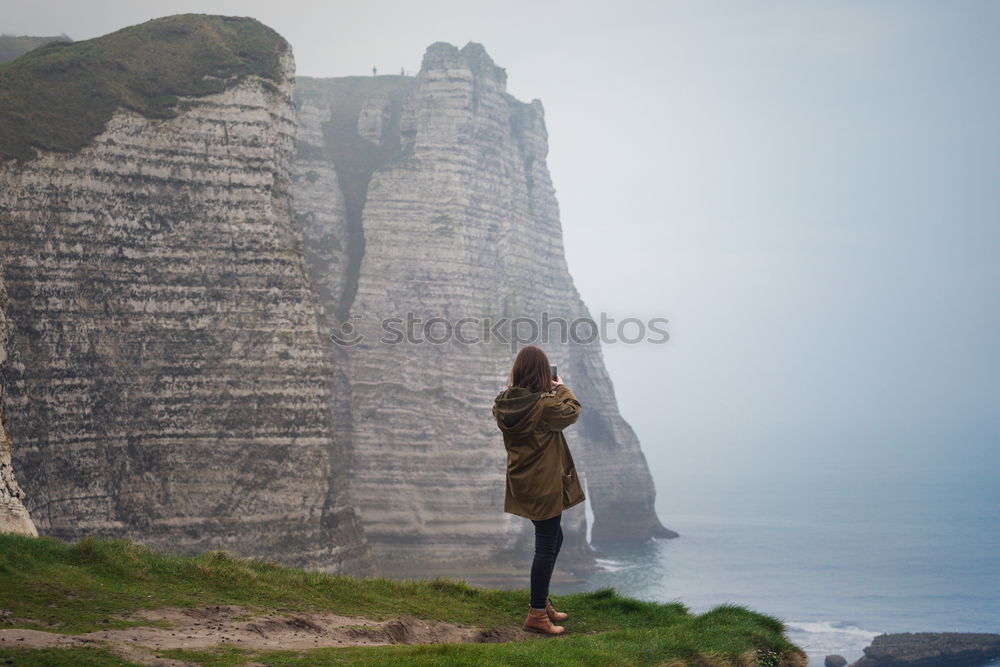 Similar – Woman standing on white cliffs by sea in England