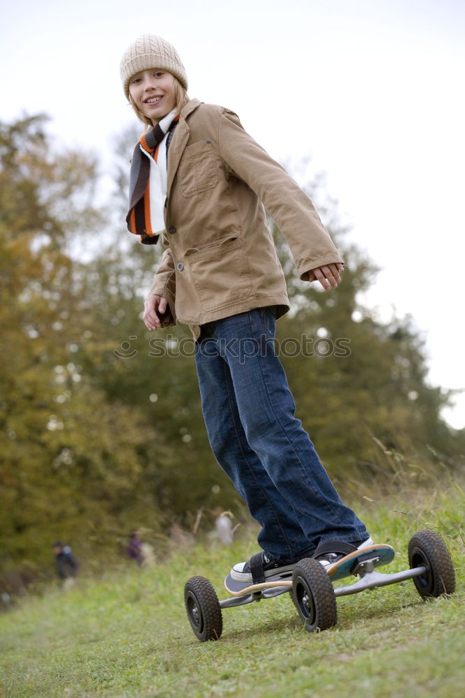 Similar – Boy with skateboard in the park