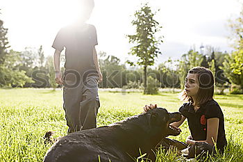 Similar – Image, Stock Photo Cheerful young man teaching his son to play mini golf