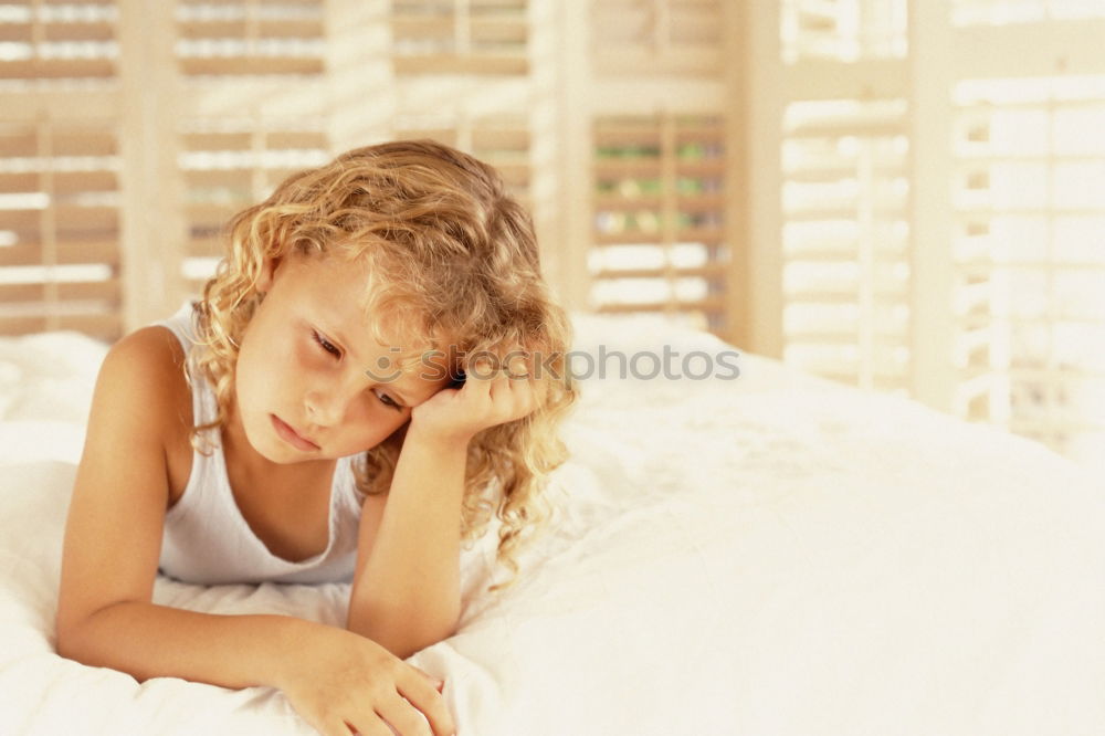 Similar – mother reading book to toddler daughter