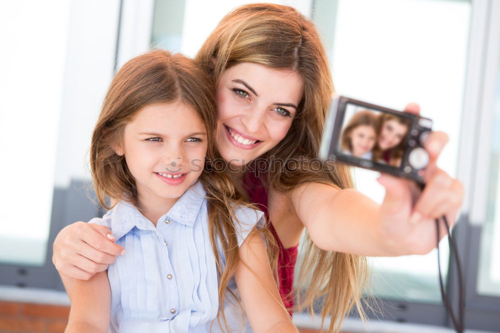 Similar – happy mother and daughter making selfie outdoor