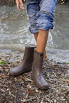 Similar – Rubber Boots Water Splashing