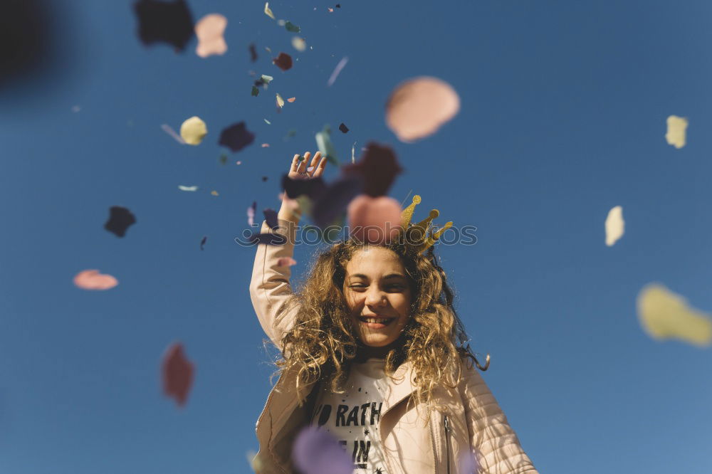 Similar – Young adult best friends cheering with confetti on party