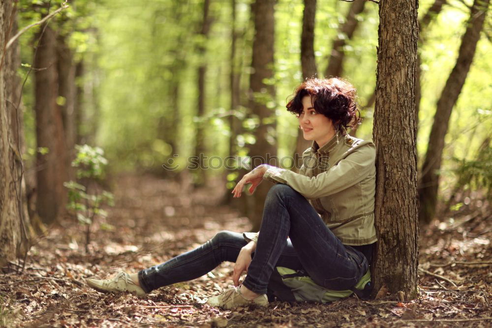 Similar – Image, Stock Photo Young woman on a tree trunk in the forest
