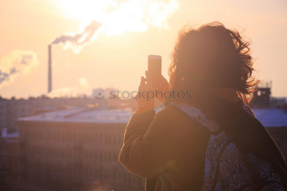 Similar – Young woman smoking near window