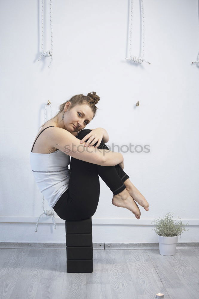 Similar – Young woman sitting on windowsill in sunlit kitchen smiling at camera