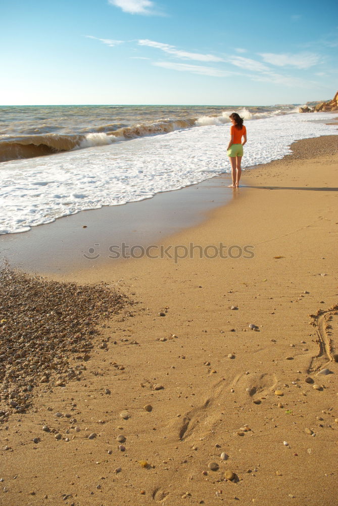 Similar – Image, Stock Photo loving couple walking on the sandy beach in a sunny day