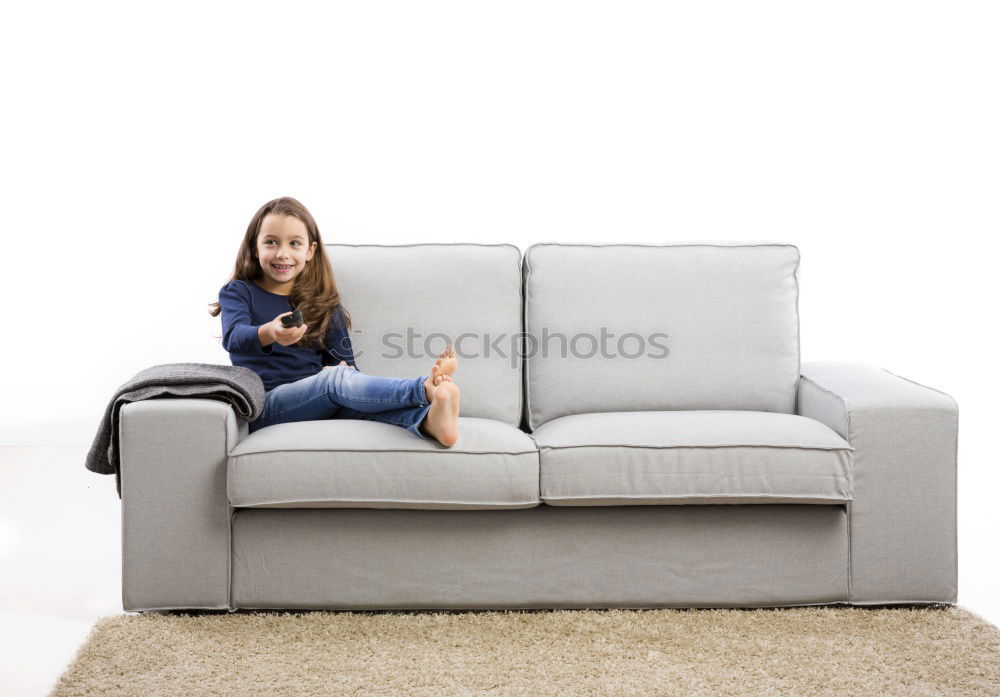 Similar – young, tall, leggy woman sits barefoot on a light couch