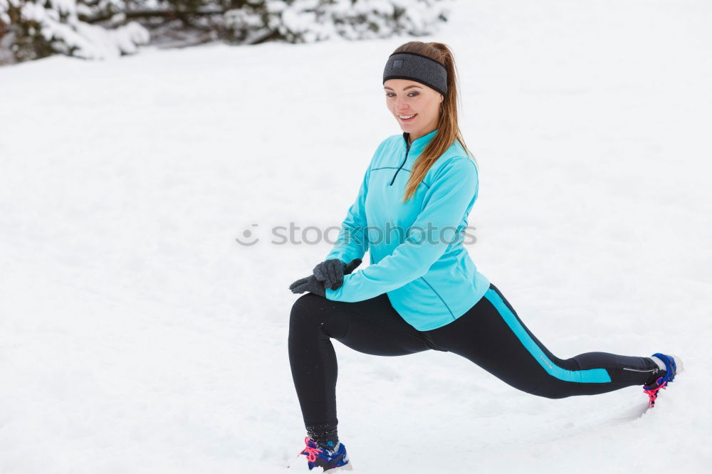 Active young woman exercising outdoors