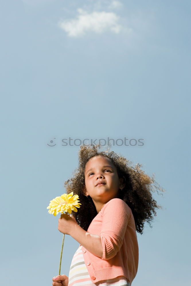 Similar – Small girl with a beautiful daisy