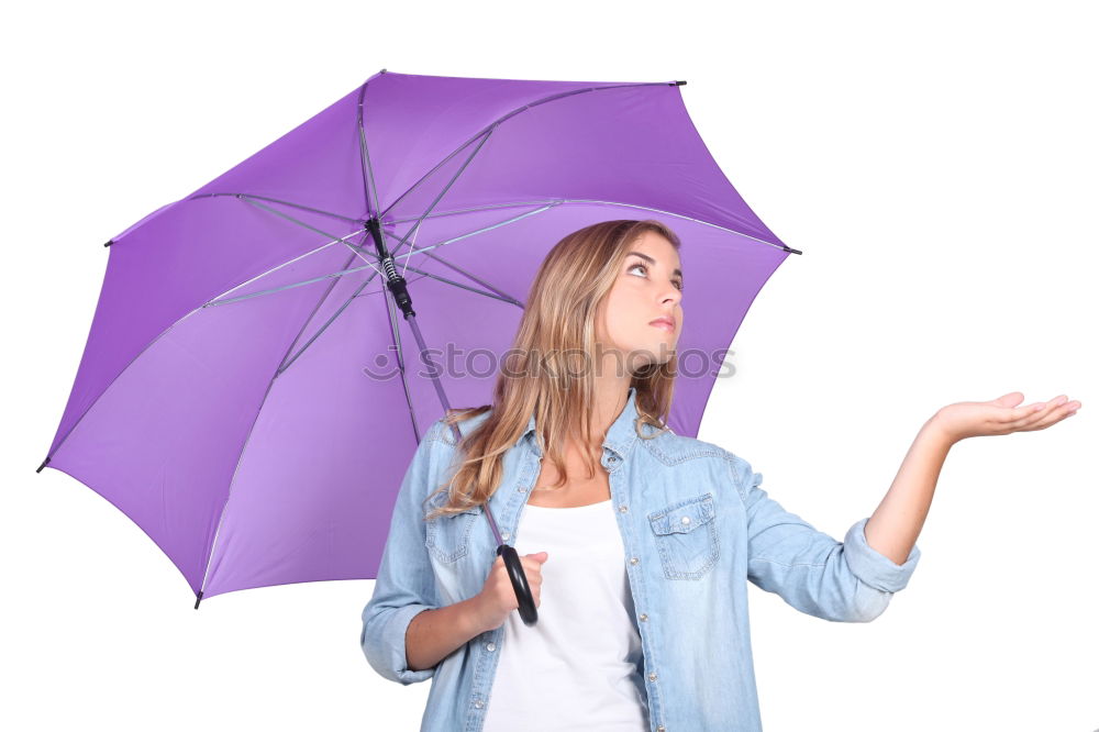 Similar – Woman with umbrella in front of green wall