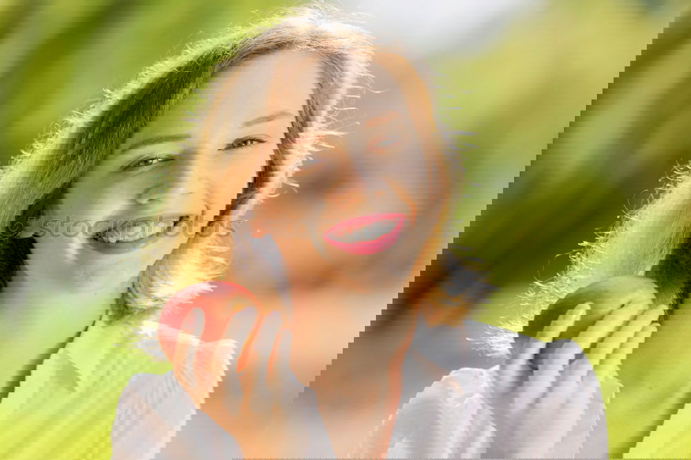 Similar – Image, Stock Photo Young woman bites an apple