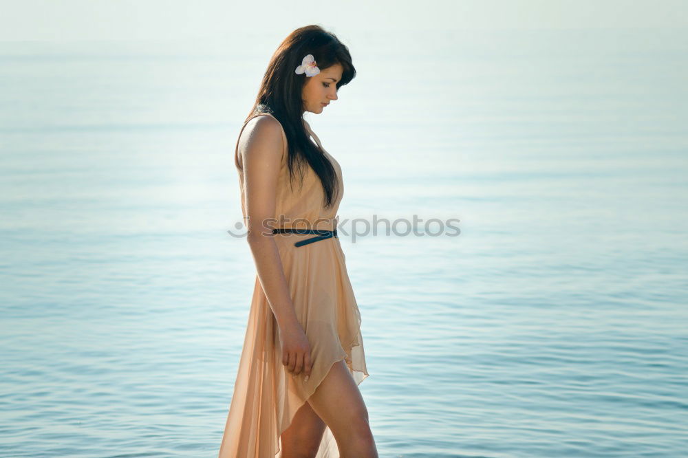 Similar – Image, Stock Photo pensive woman on the beach