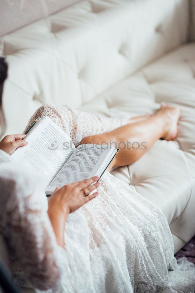 Similar – Image, Stock Photo woman reading a book and drinking coffee on bed with socks