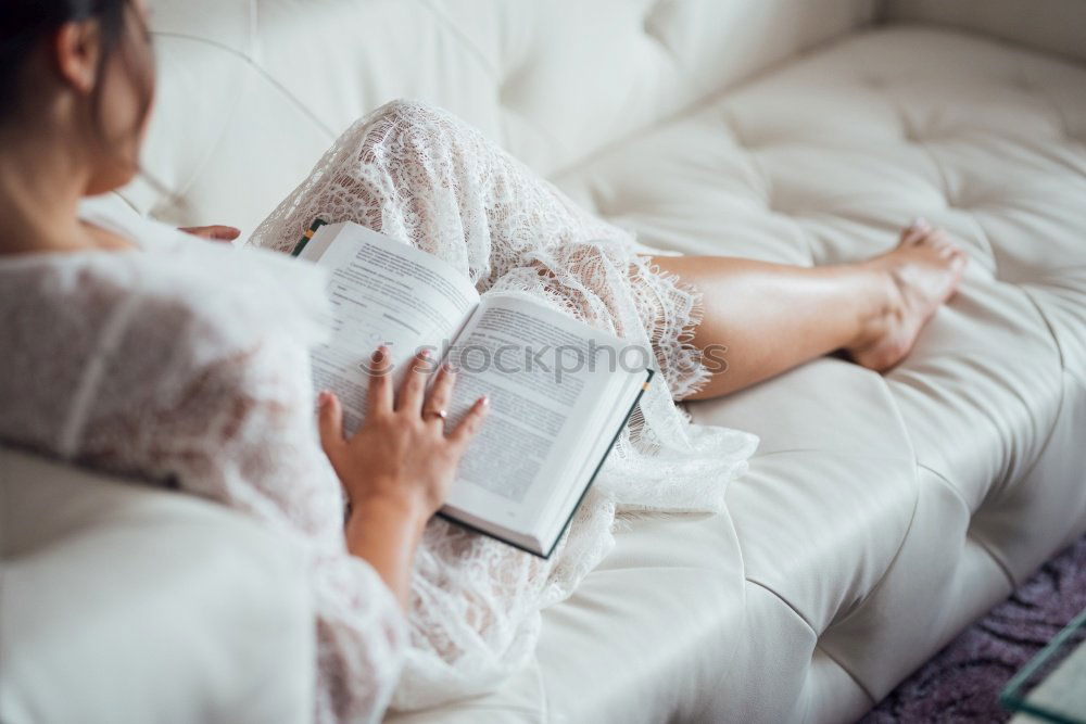 Similar – Young woman reading in her room