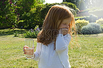 Similar – Kid girl playing with garden sprinkler