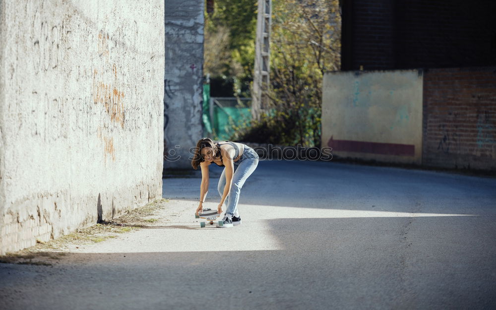 Similar – Image, Stock Photo Woman stretching her body in front of ancient wall in park