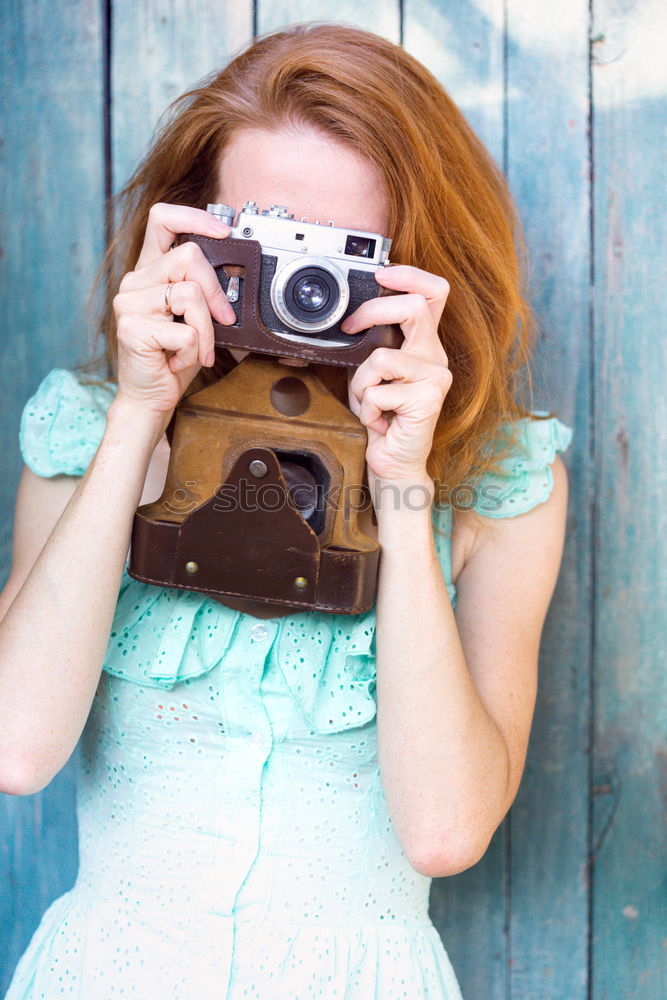 Similar – Young redhead photographer woman