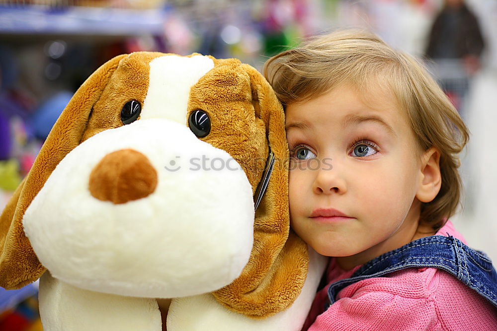 Similar – Young girl cuddles stuffy