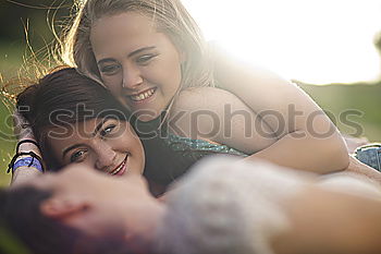 Similar – Image, Stock Photo Two teenage girls having fun on beach pulling faces