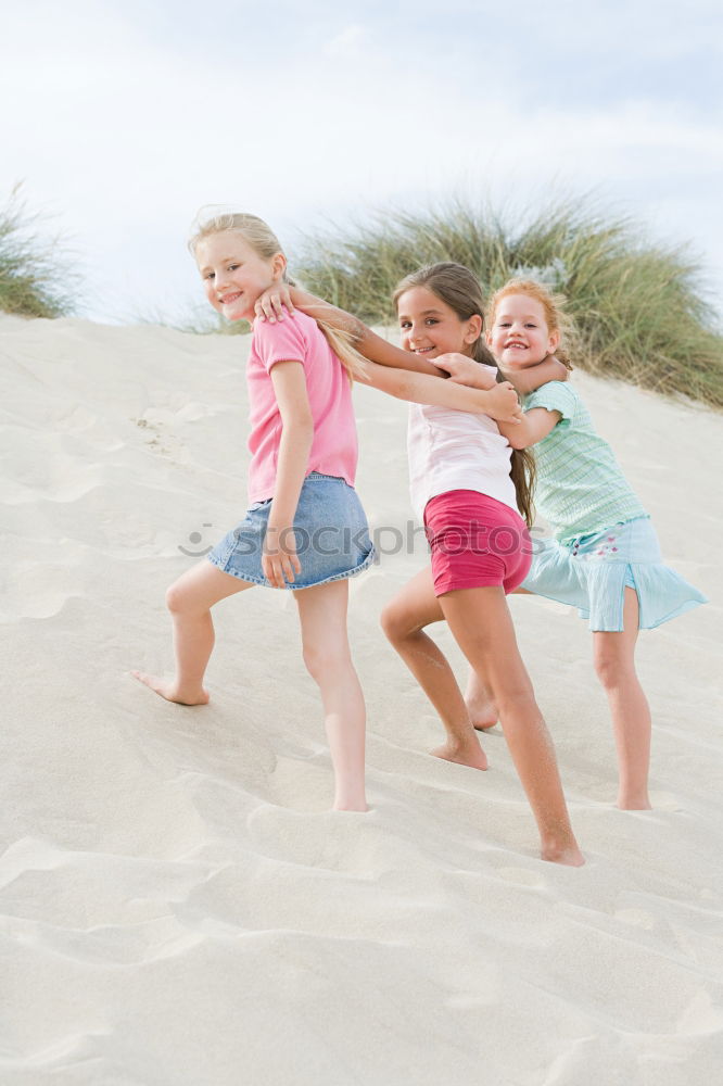 Similar – Two happy children playing on the beach