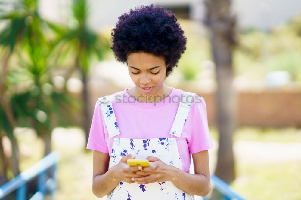 Similar – Image, Stock Photo Smiling woman looking at her smart phone outdoors