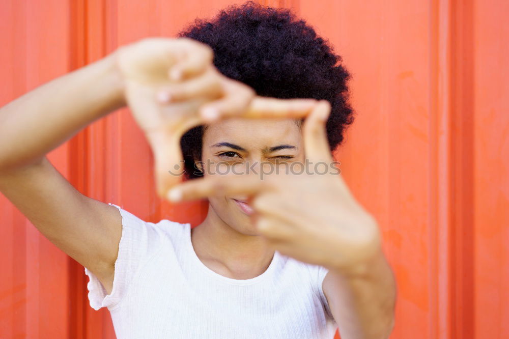 Similar – Image, Stock Photo Black man with afro hair putting on sunglasses. Sunglasses and a