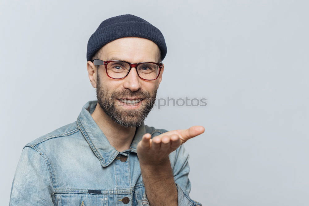 Similar – Portrait of a man with glasses and mustache with crossed arms