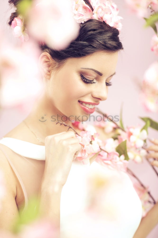 Similar – Young woman smelling almond flowers in springtime