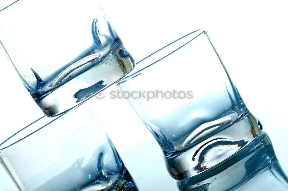 Similar – Half glass of water standing on the counter