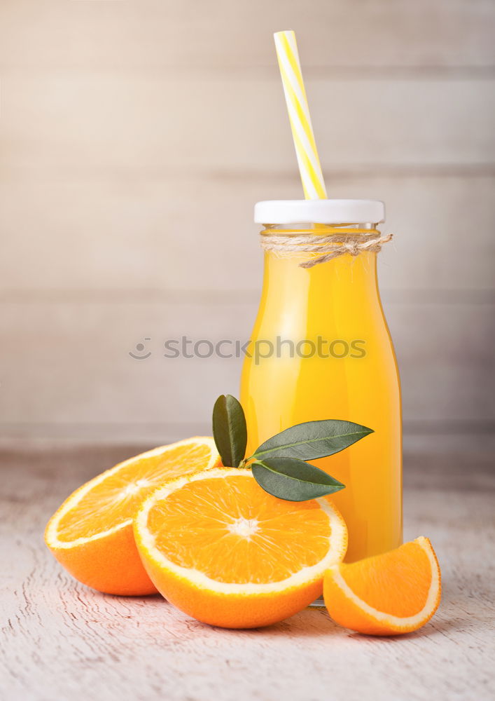 Similar – Glass of orange juice with slices of citrus fruit