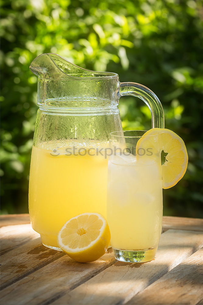 Similar – Elder lemonade with lemon on old table wood