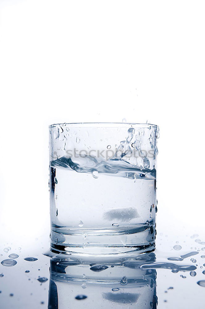 Similar – Glass filled to the brim with water in monochrome blue.