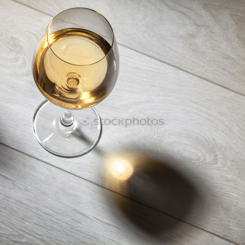 Similar – Glass of wine on wooden table