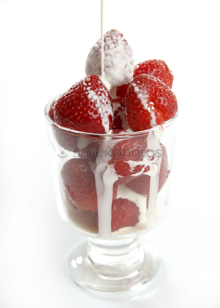 Similar – Pink sweet lemonade made of raspberry juice with frosted blackberries and strawberry blossom in a glass with sugar rim and drinking straw on striped tablecloth