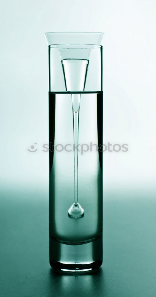 Similar – Water glass half full or half empty