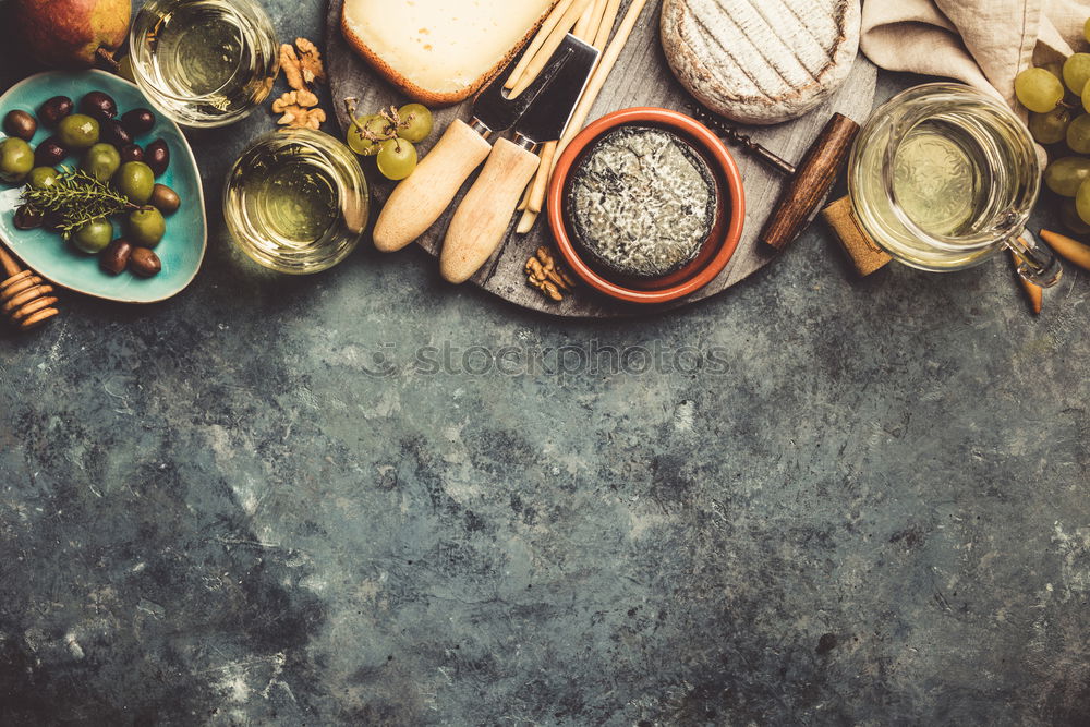 Similar – Home breakfast preparation with bagel bread, salmon, avocado , fresh cheese, hummus and cooked quail eggs on dark rustic wooden background, top view. Copy space for your design, banner