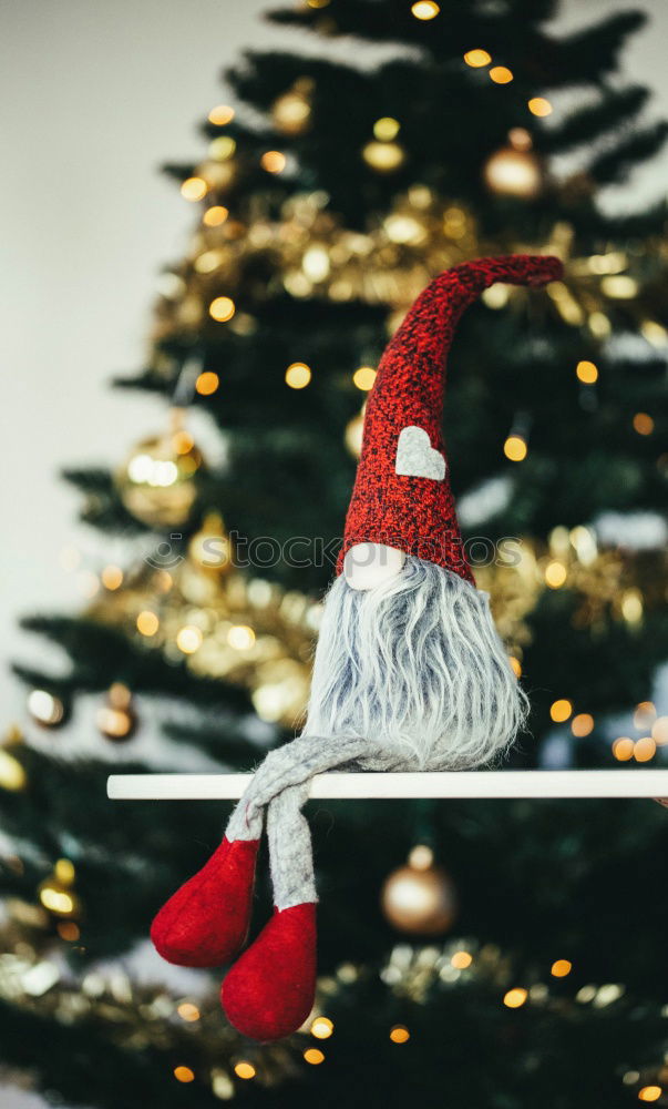 Christmas decorations over a swing in a park