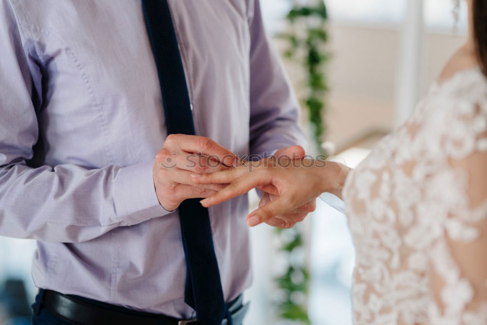 Similar – Image, Stock Photo Woman buttoning up man waistcoat