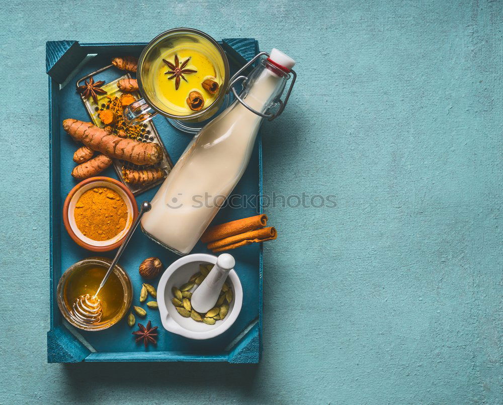 Image, Stock Photo Golden turmeric milk on tray with ingredients