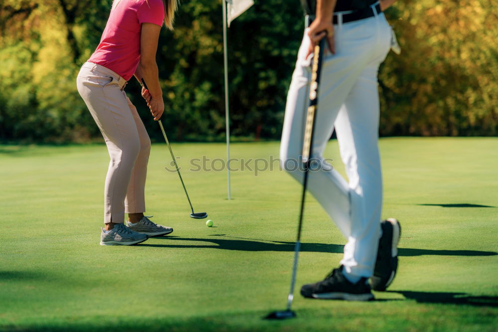 Similar – Female golfer practicing on a driving range