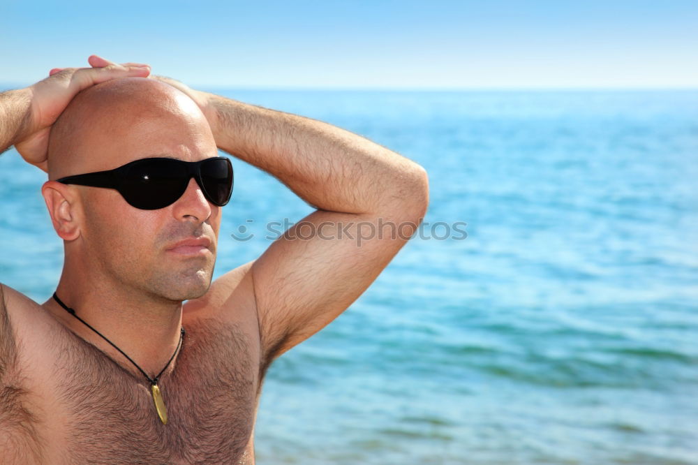 Similar – Diver in wet suit standing on beach